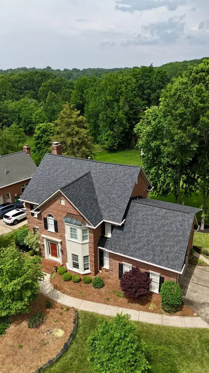Drone view of residential roofing work by Charlotte Premier Roofing