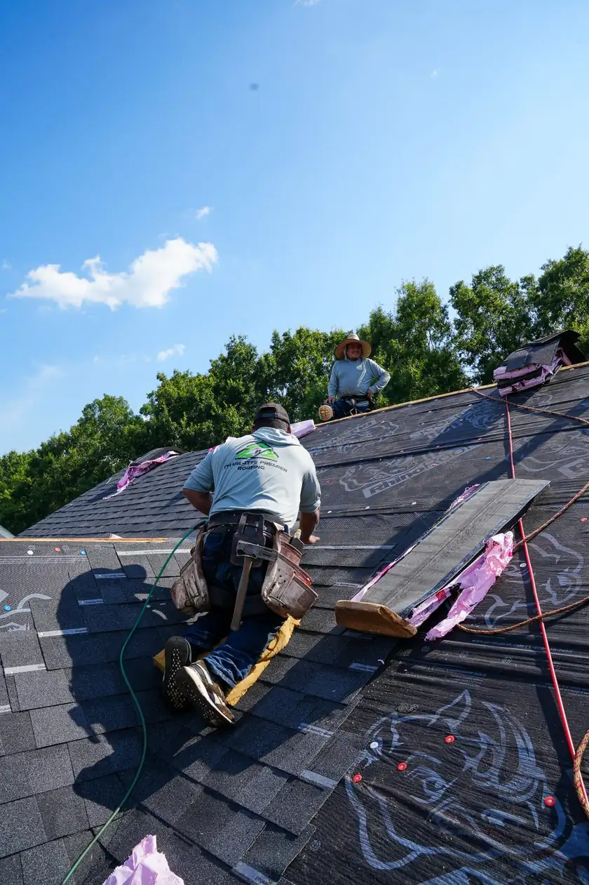 Charlotte Premier Roofing crew replacing a residential shingle roof