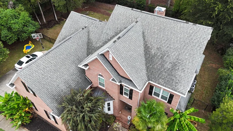 Before: the old roof on a brick home off Providence Road in Charlotte
