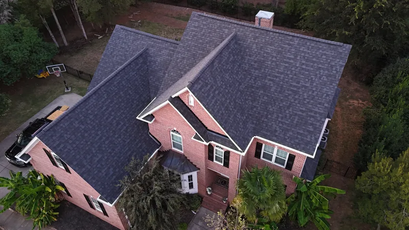 After: the new Owens Corning Duration roof in Onyx Black on the same home