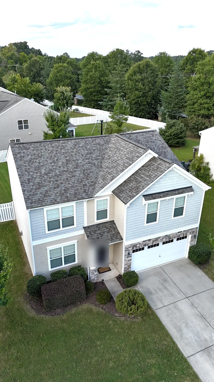 Drone view of a finished architectural shingle roof on a two-story home in Charlotte, NC